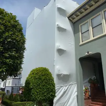 Building covered with white tarp