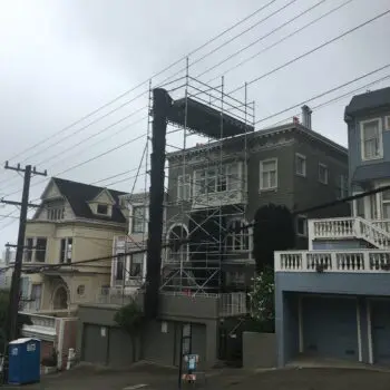 House renovation scaffolding on street