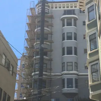 Building exterior under construction scaffolding