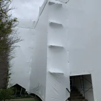 Building covered in protective wrap