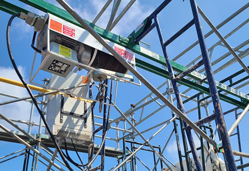 Construction scaffolding under blue sky