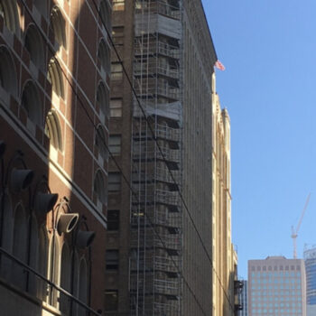 Building with exterior scaffolding construction