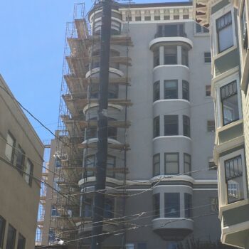Building exterior under construction scaffolding